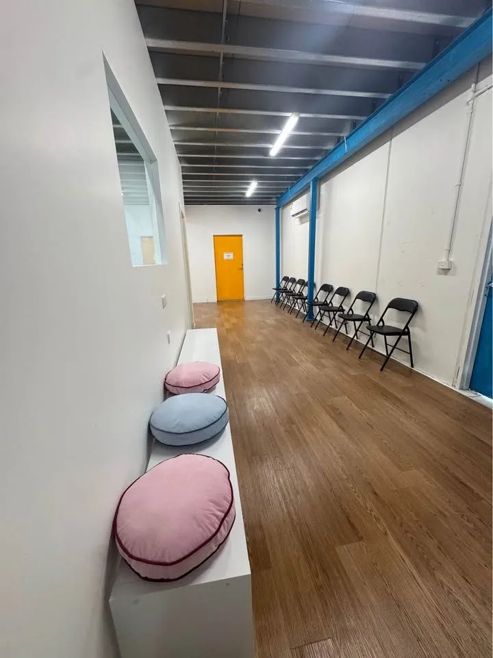 Studio hallway with seating at Mister & Missy Dance Co.